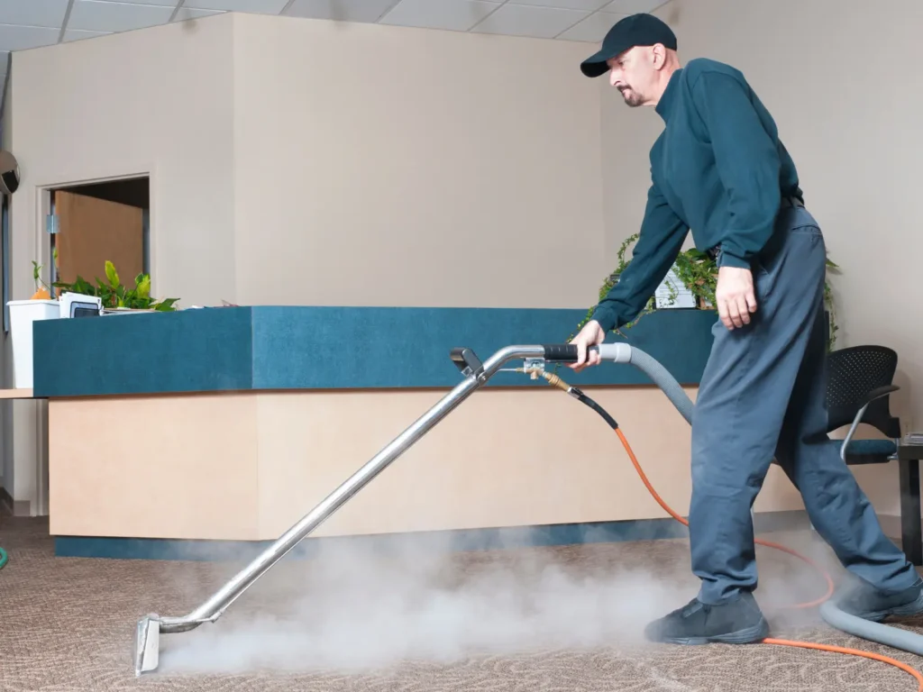 commercial carpet cleaning in progress showing a powerfull extraction machine in use